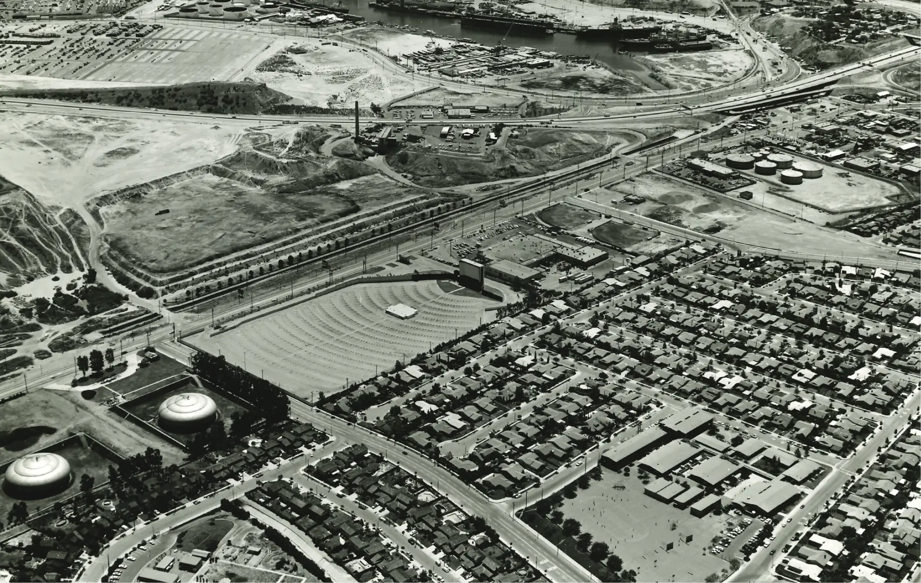 Historical black and white photo of San Pedro site with drive-in movie theatre